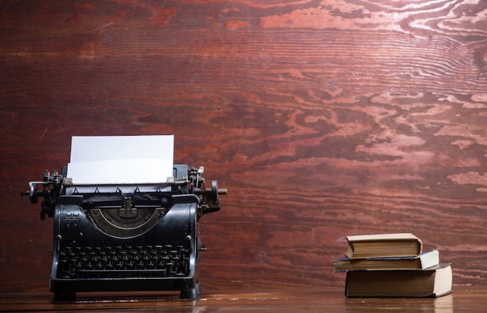 typewriter and books